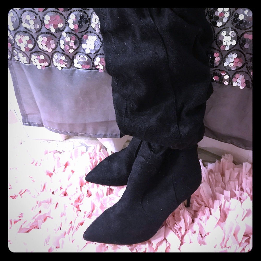 Black suede scrungy boots with zipper on side.